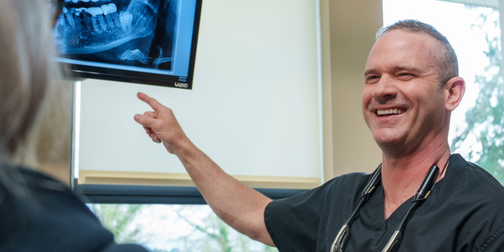 Doctor Pointing at dental x-ray