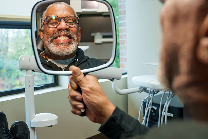 Patient looking into mirror Smiling