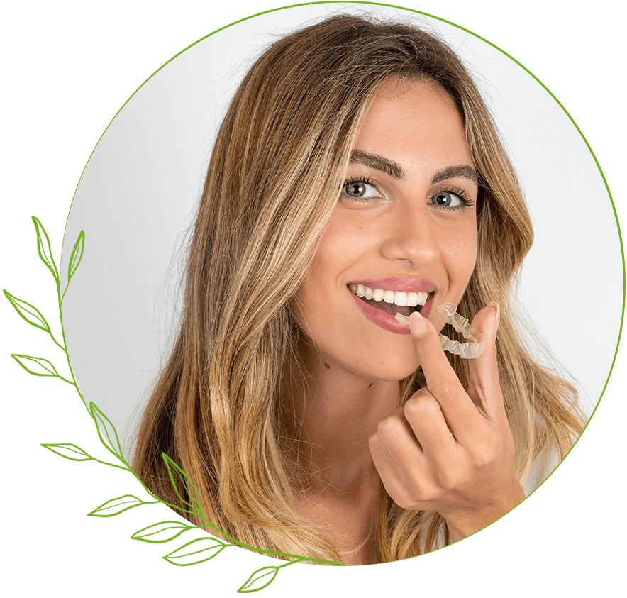 Woman putting clear aligners in her mouth