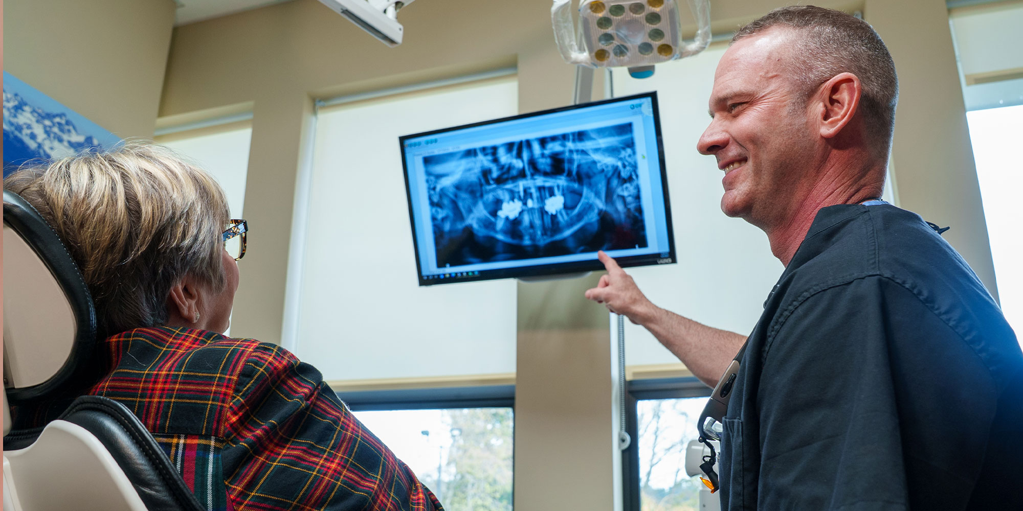 Doctor Pointing to dental x-ray