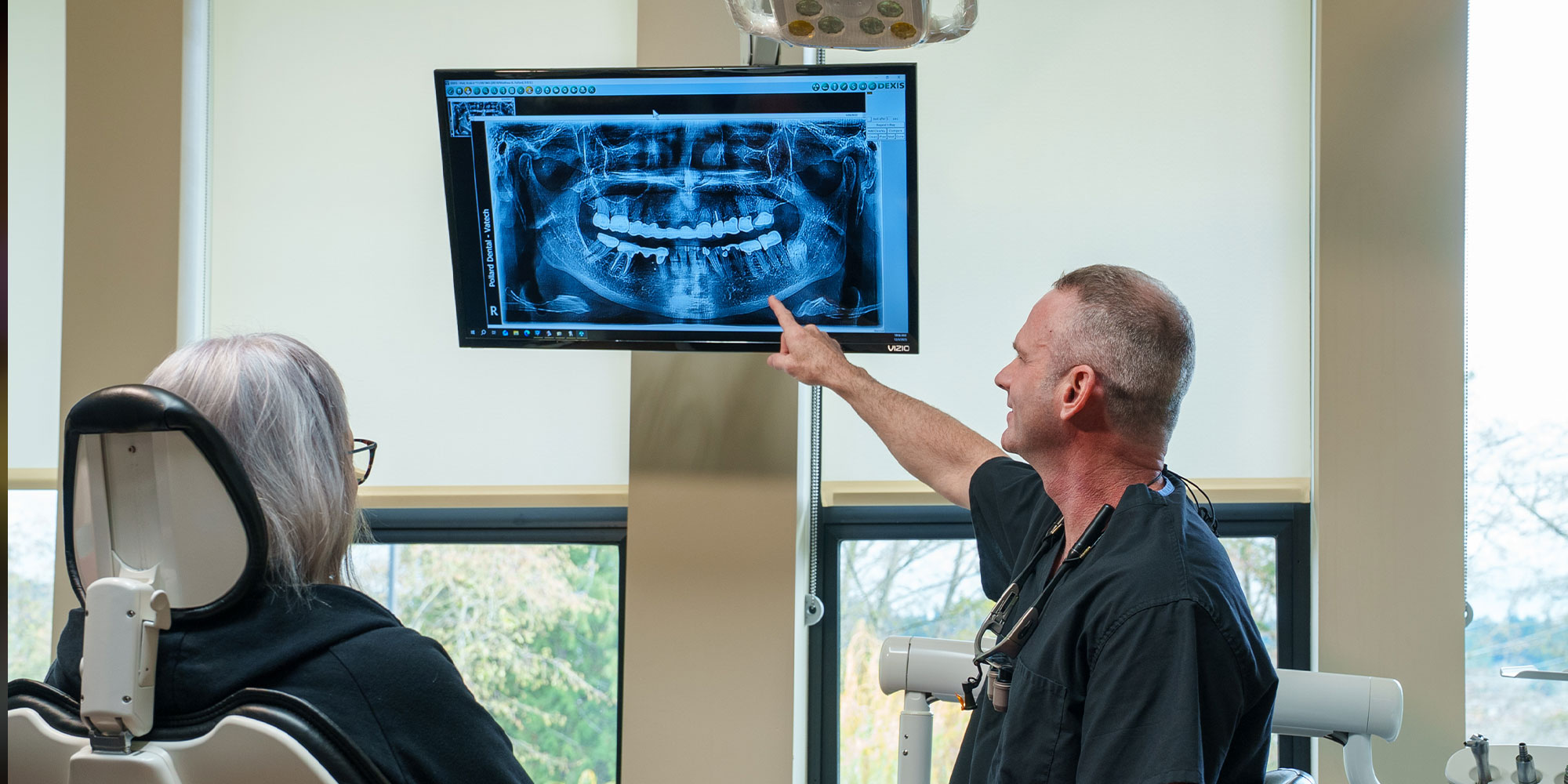 Doctor pointing at dental x-ray